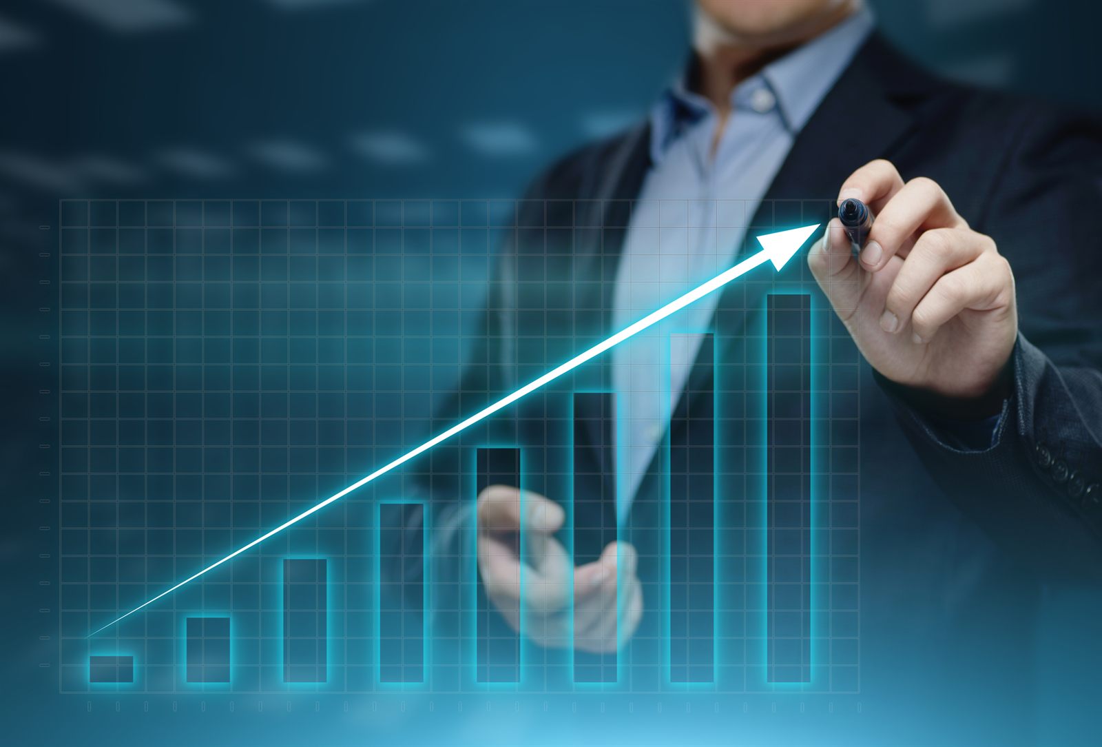 Hand drawing a rising arrow over a glowing bar chart