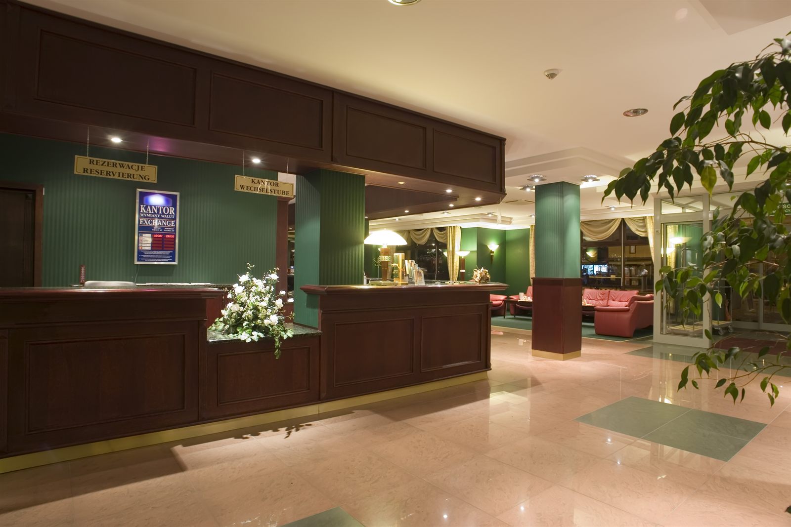 Reception desk and lounge seating in an elegant lobby